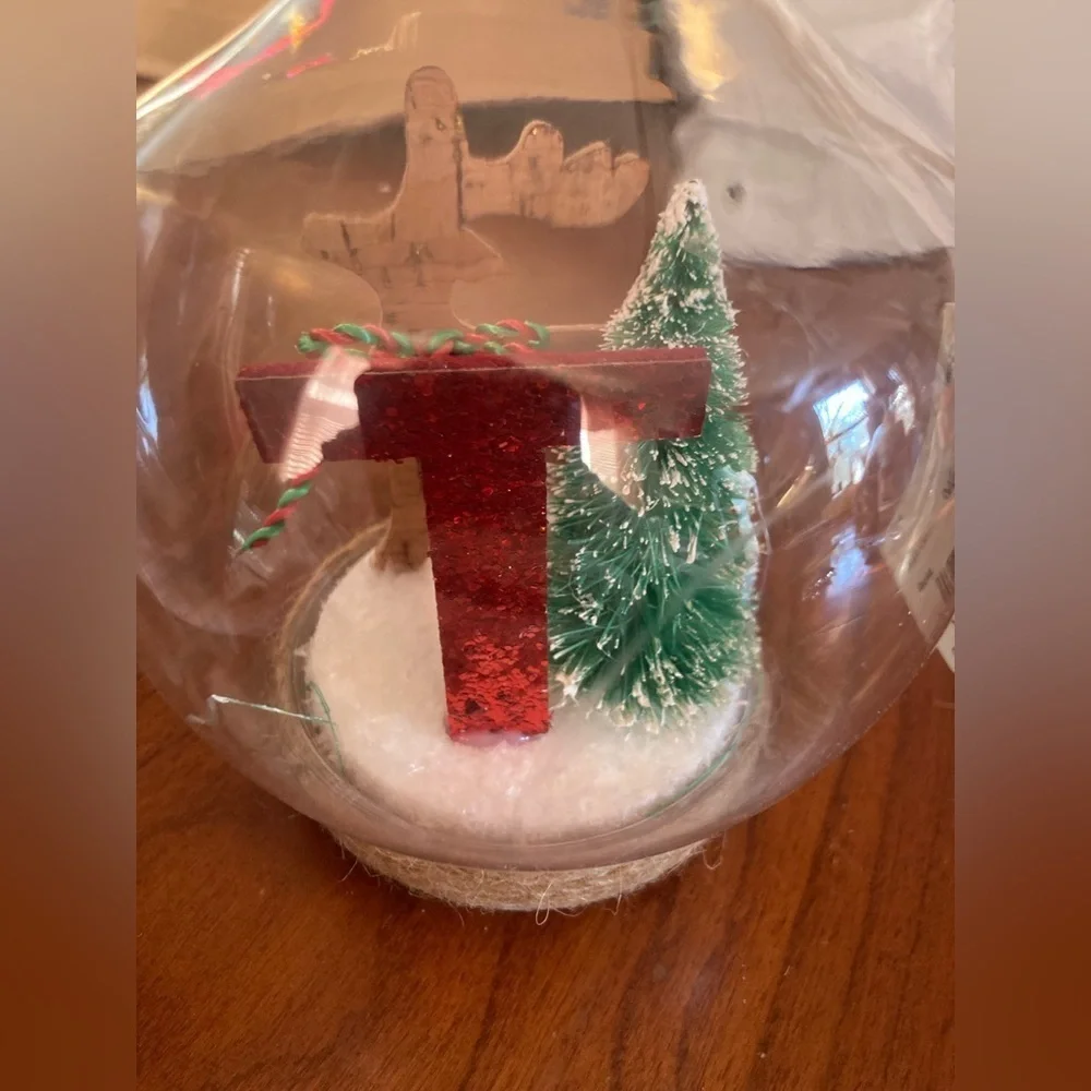 Holiday plastic globe Ornament with Red Letter T and Green Tree. Brand new